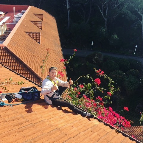 Safely accessing the roof to clean the gutters and to admire the garden view. #saferoofcleaning #safetyfirst #gardenview #rooftop #roofing #thumbsup